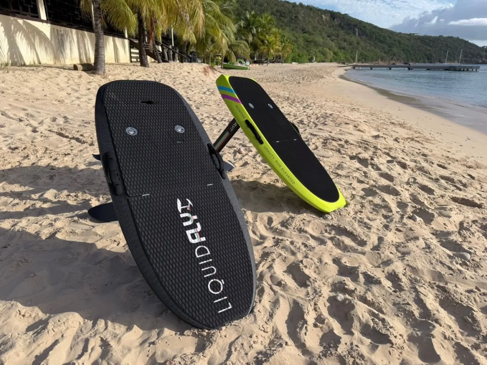 Liquid Flyt eFoil boards paired on the beach at Crocus Bay