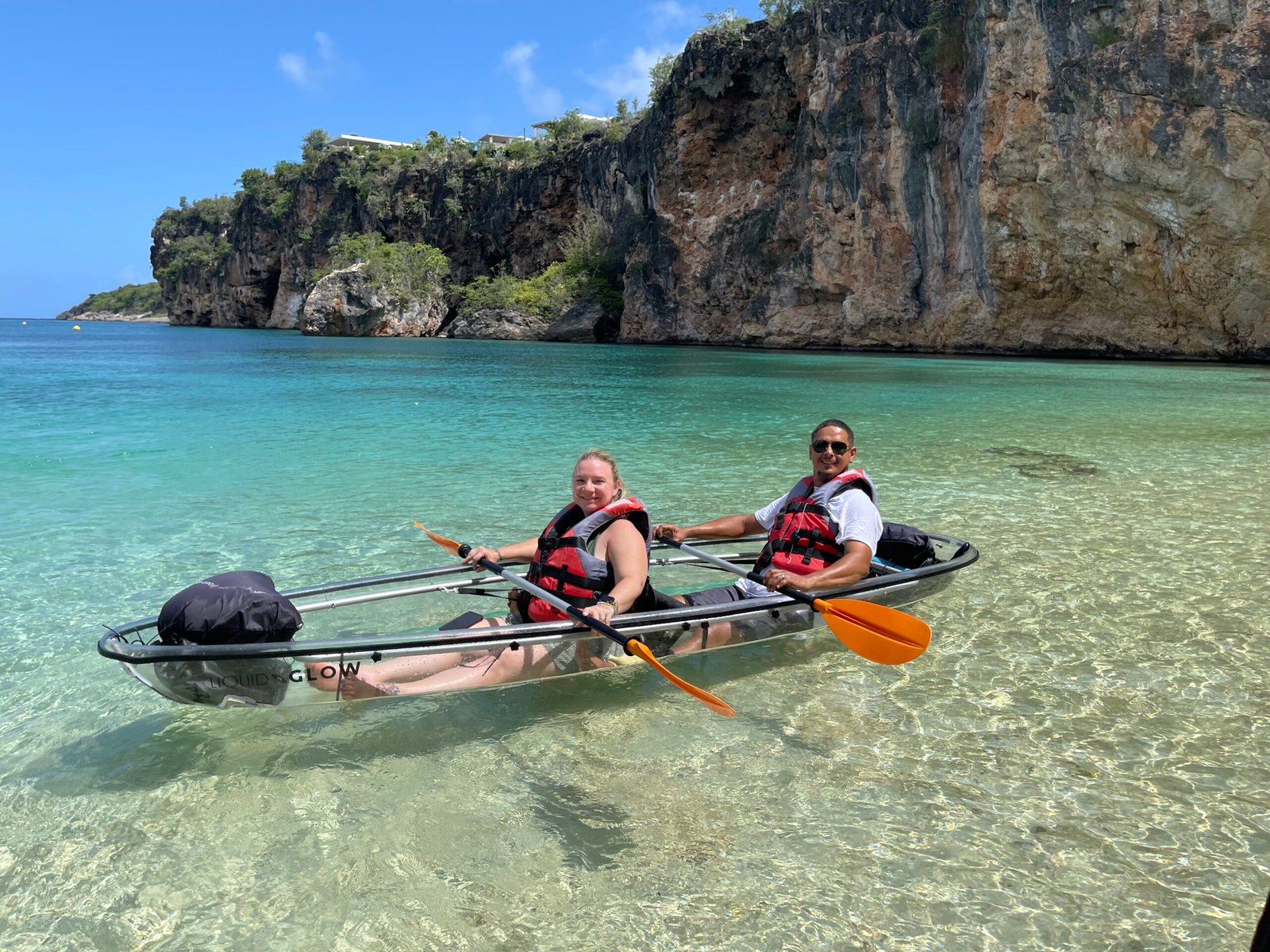 Private kayak group near cliffs
