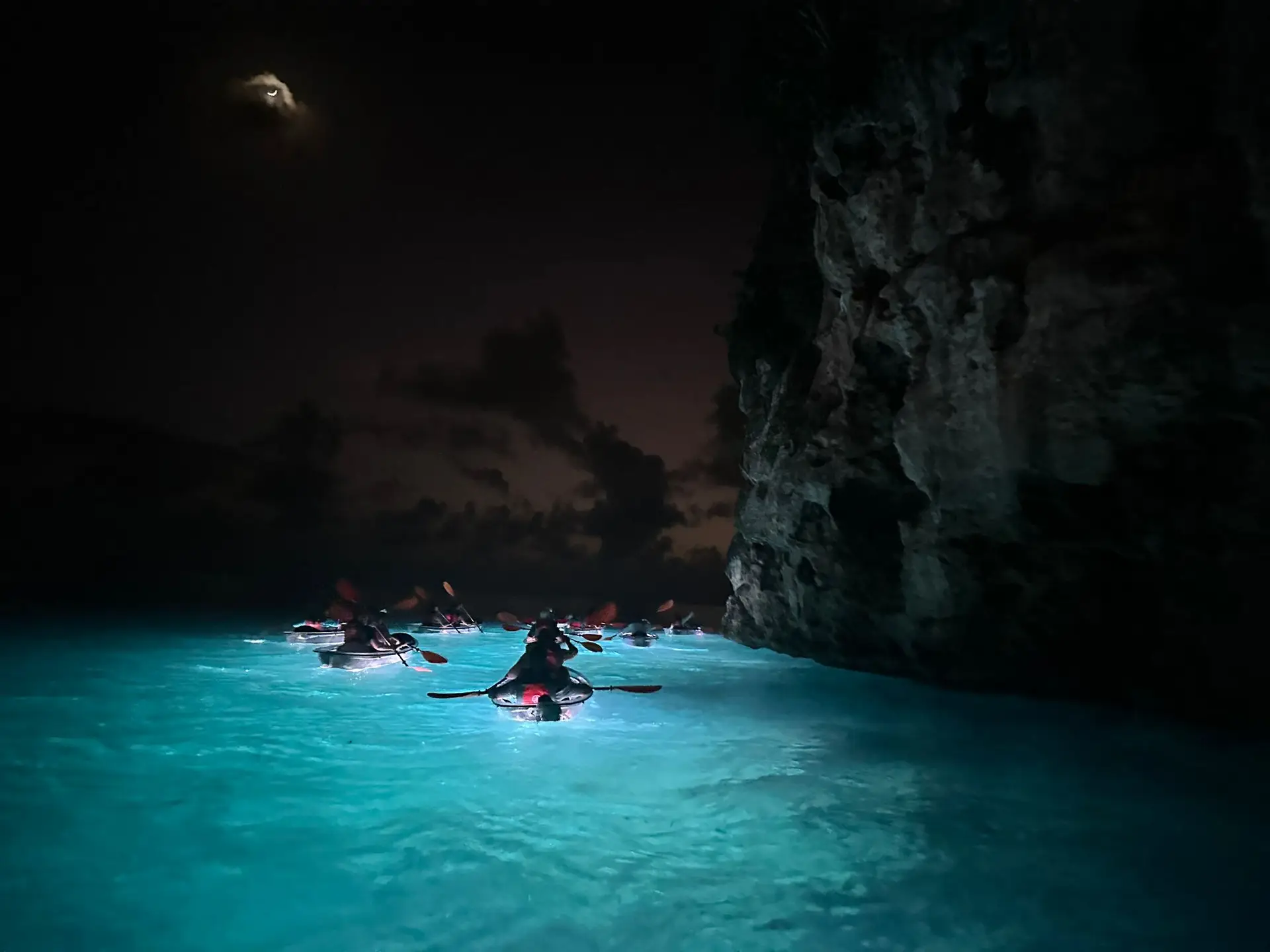 Night kayaking near cliffs